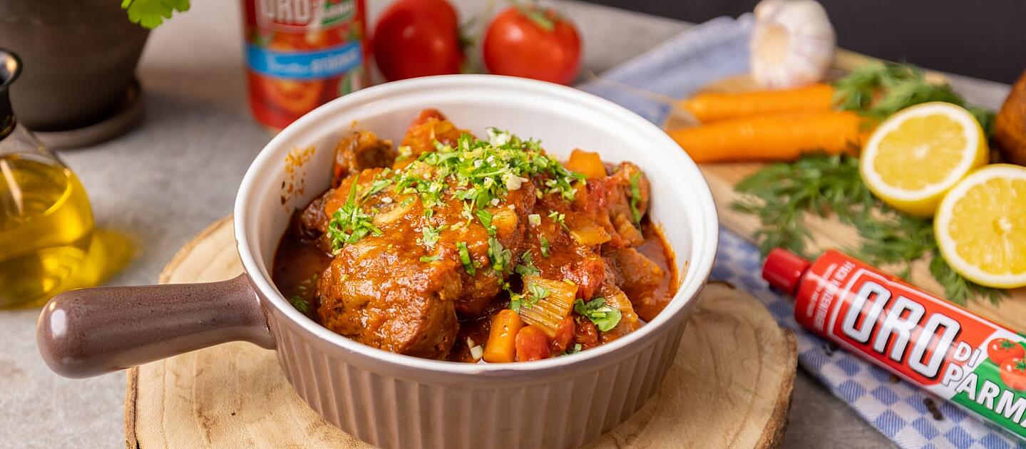 Ossobuco alla milanese in a brown bowl.